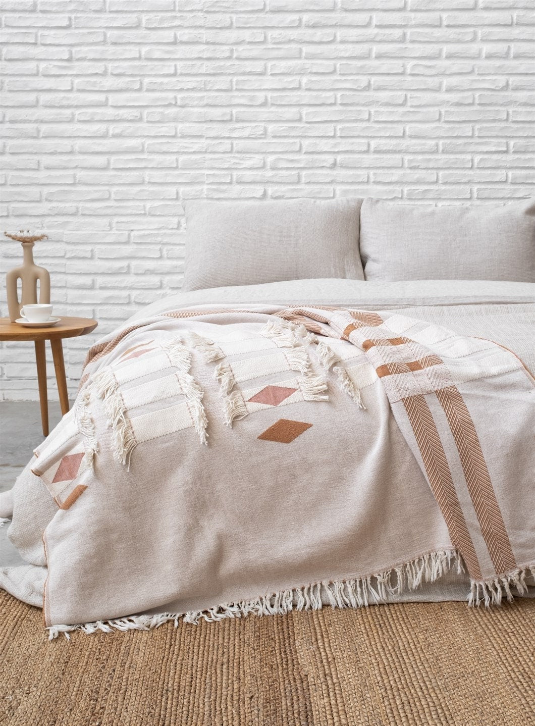 The Cotton Boho Sofa Throw Blanket that is considered a